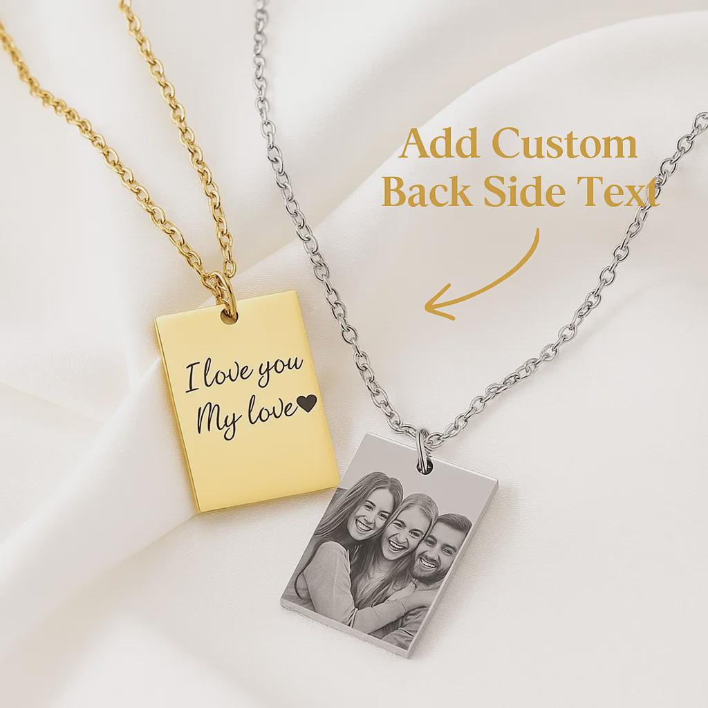 Two necklaces with engraved pendants on a light background